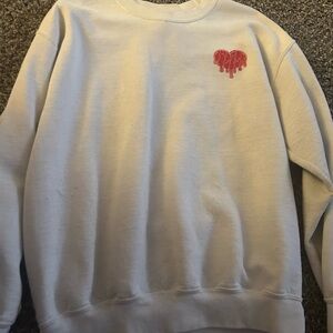 White Sweatshirt with Red Heart Design